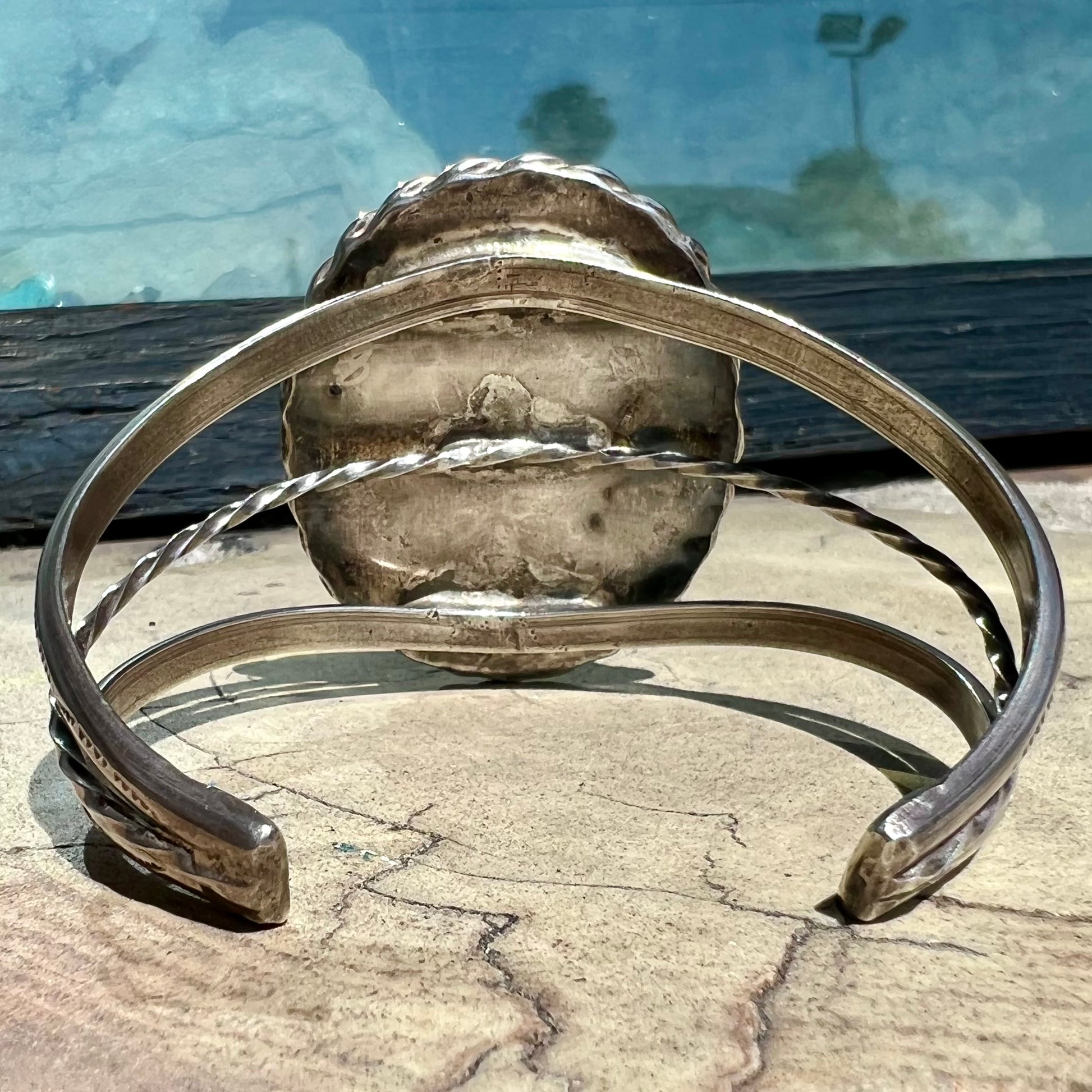 A sterling silver rope bezel set picture jasper cuff bracelet.