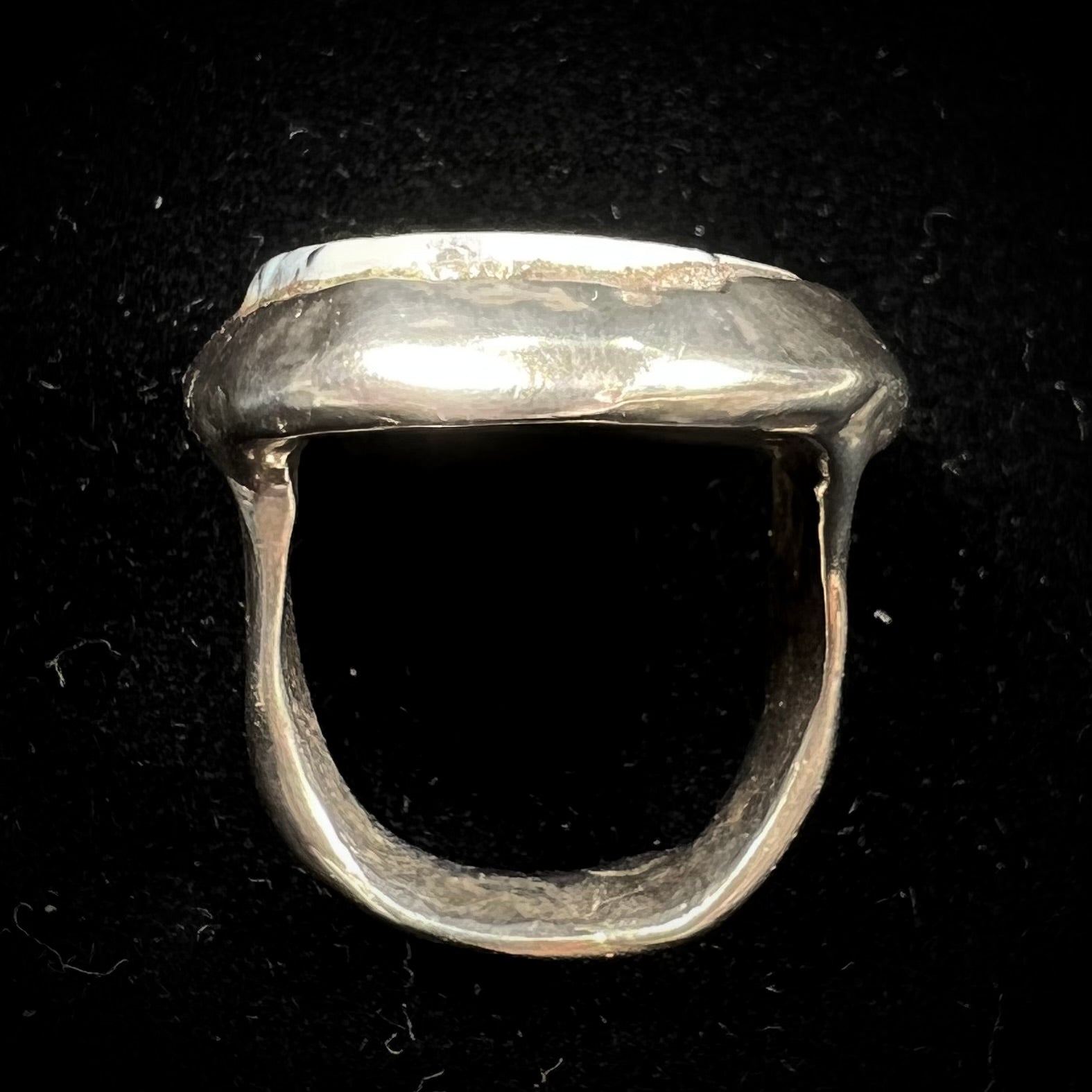 A bezel set ring handmade in sterling silver with a white dendritic agate stone.
