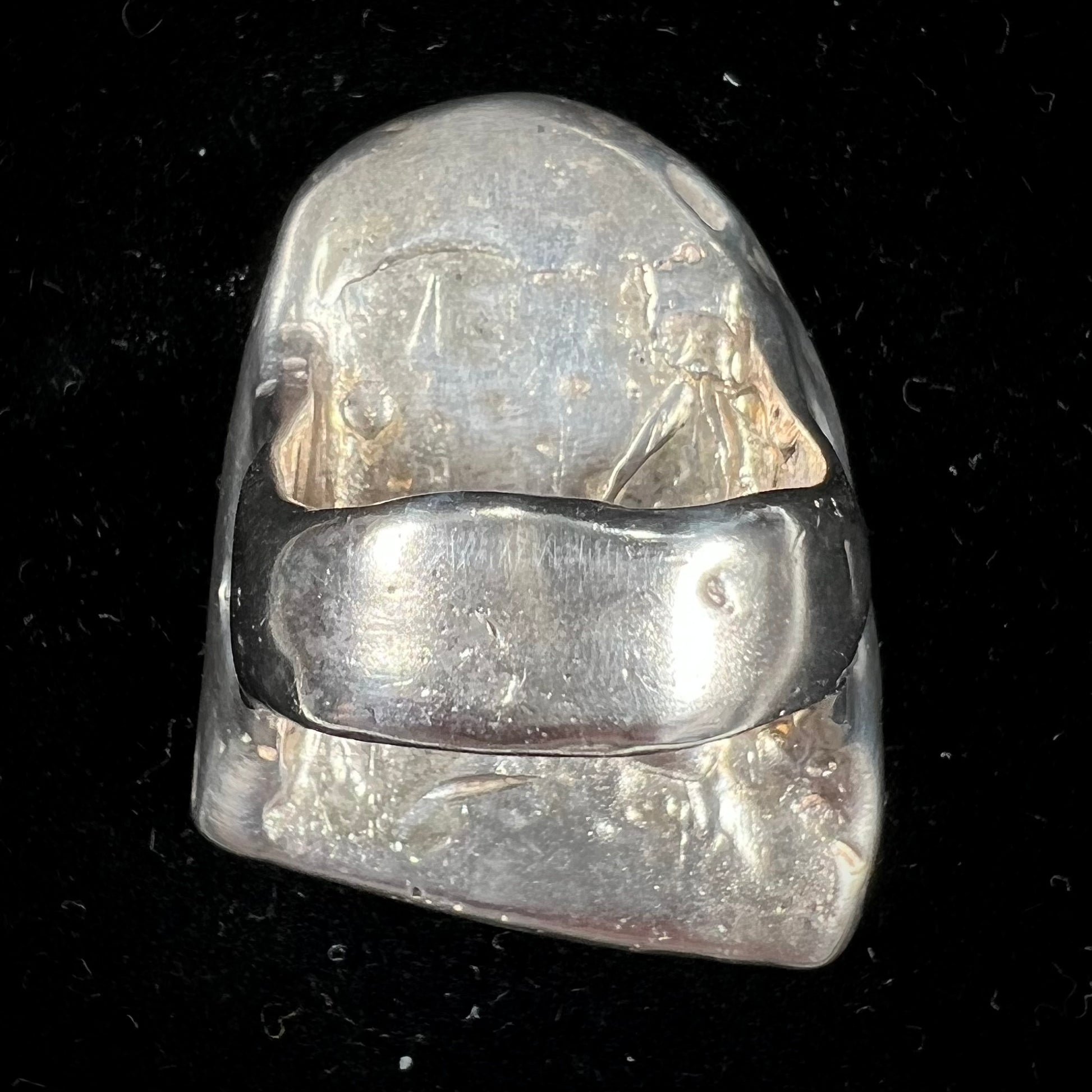 A bezel set ring handmade in sterling silver with a white dendritic agate stone.