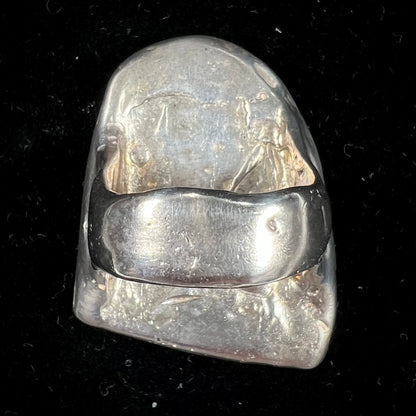 A bezel set ring handmade in sterling silver with a white dendritic agate stone.