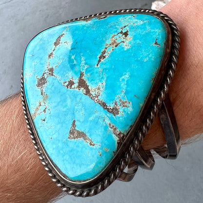 A sterling silver Morenci turquoise cuff bracelet.  The turquoise is large and has orange copper veins.