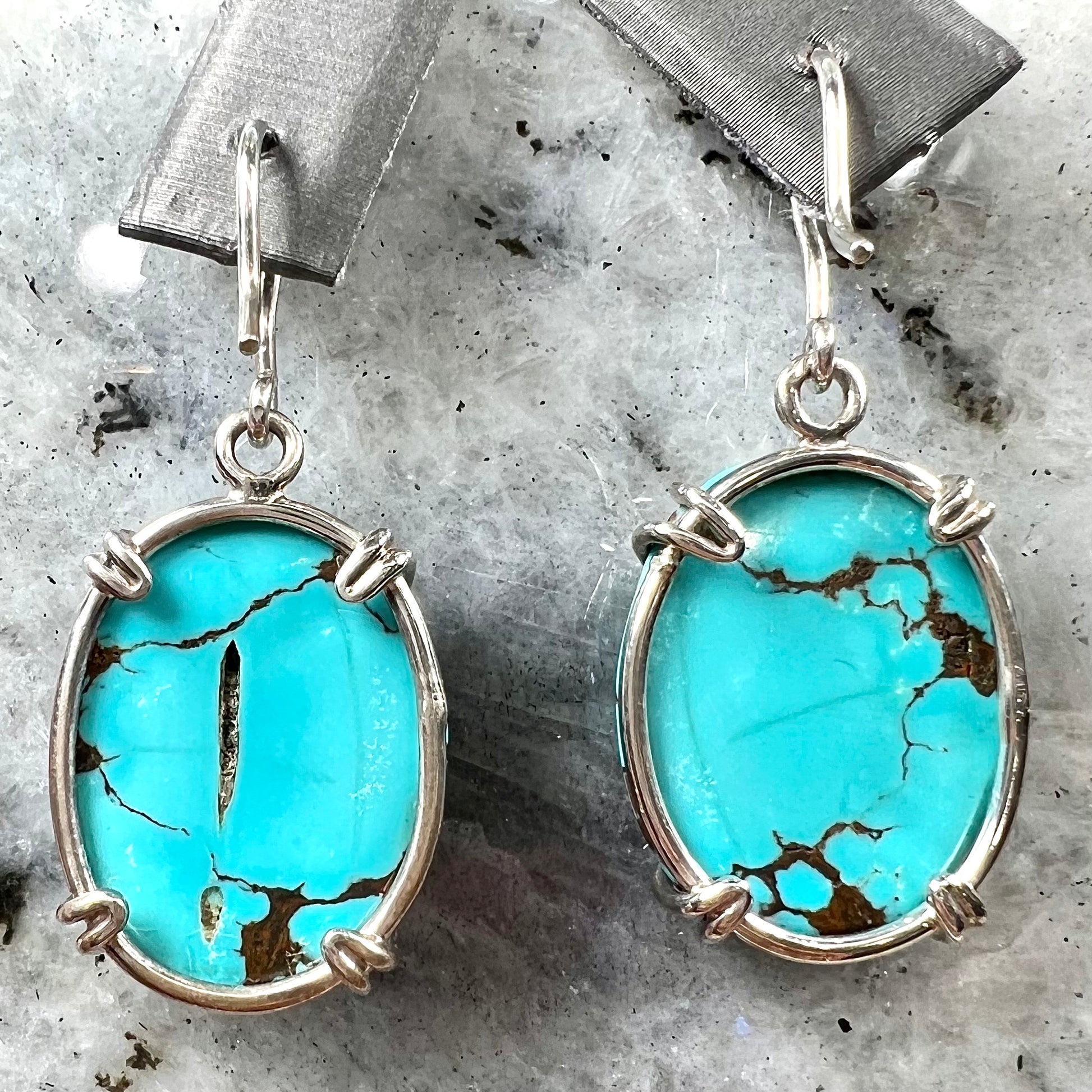 Sterling silver French wire earrings double prong set with cabochon cut turquoise from Valley Blue Mine in Lander County, Nevada.