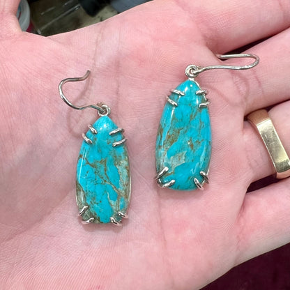 Sterling silver French wire earrings double prong set with cabochon cut turquoise from Pilot Mountain Mine.