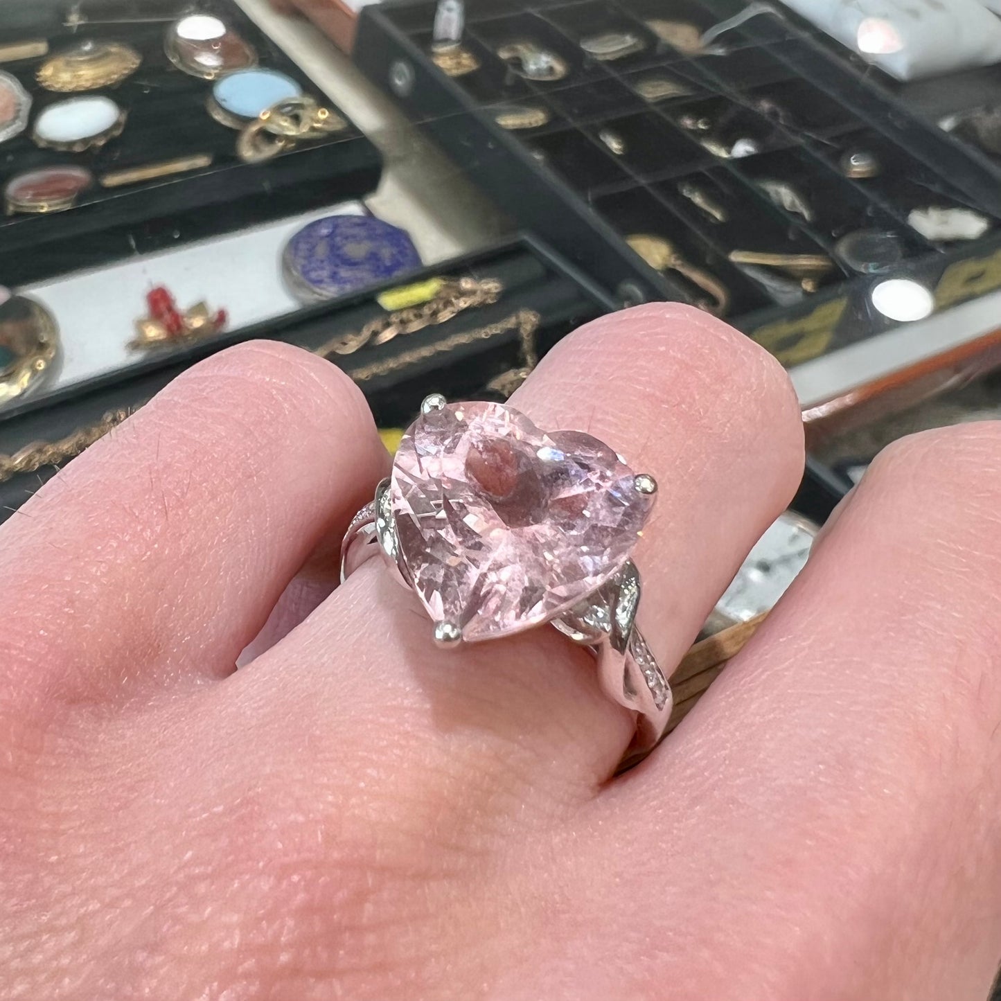A white gold and diamond heart shaped morganite engagement ring.