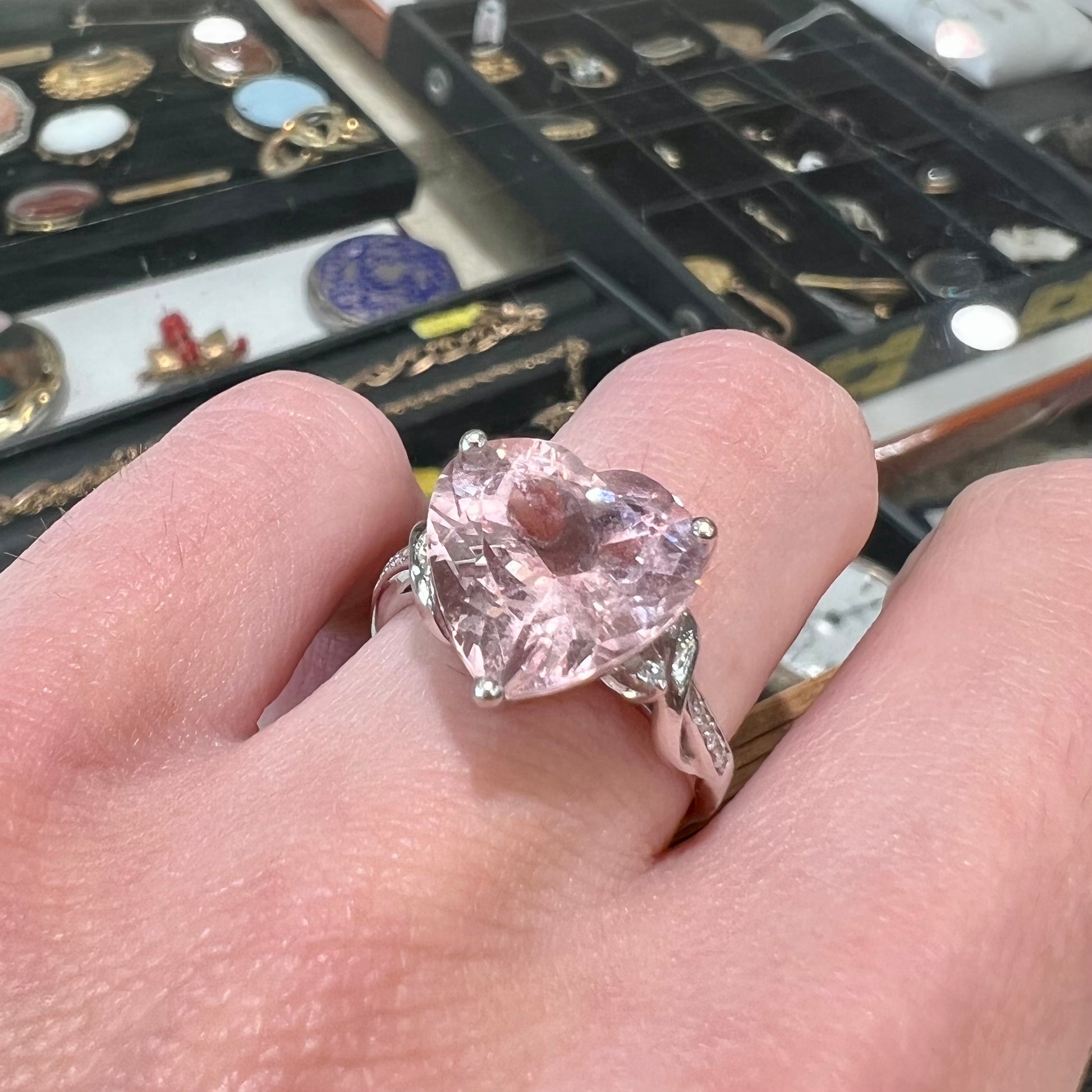 A white gold and diamond heart shaped morganite engagement ring.
