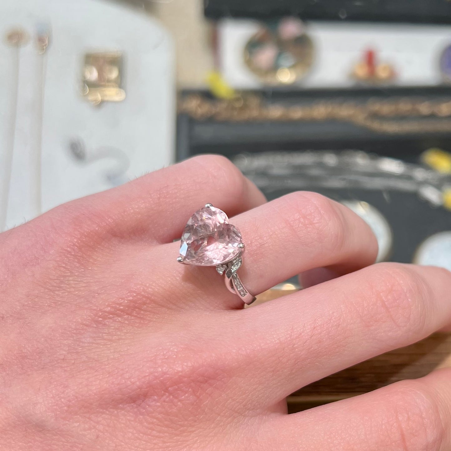 A white gold and diamond heart shaped morganite engagement ring.