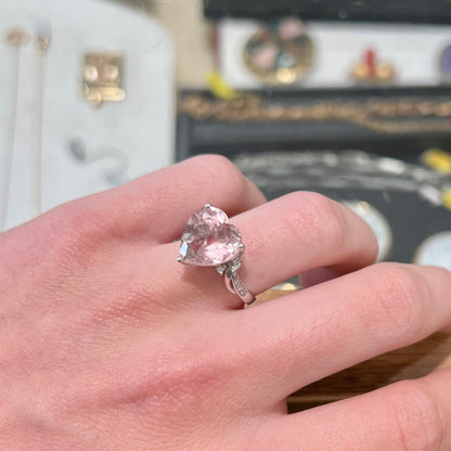 A white gold and diamond heart shaped morganite engagement ring.