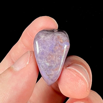 A piece of natural, tumbled purple turkiyenite jade.  Material from Turkey and shaped like a rough heart.