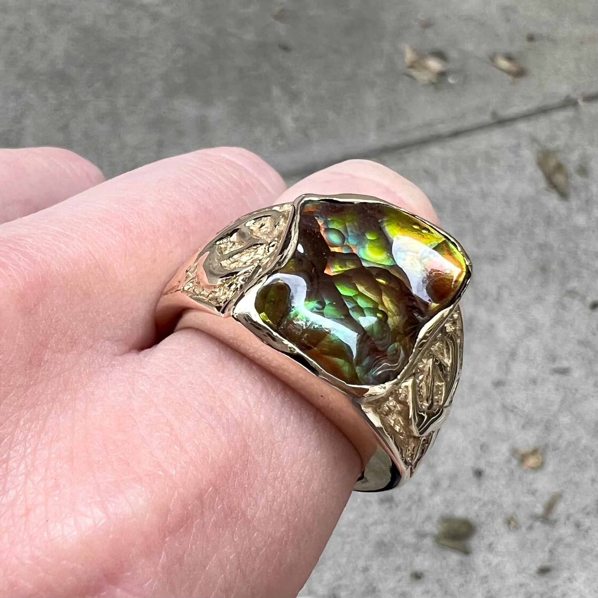 Custom, heavy yellow gold men's ring set with fire agate from Deer Creek, Arizona.
