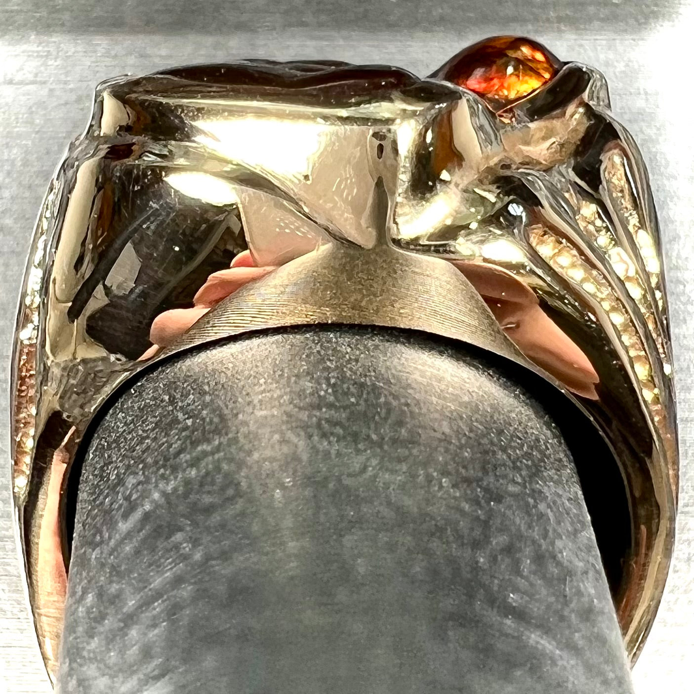 A men's custom fire agate solitaire ring cast in yellow gold.