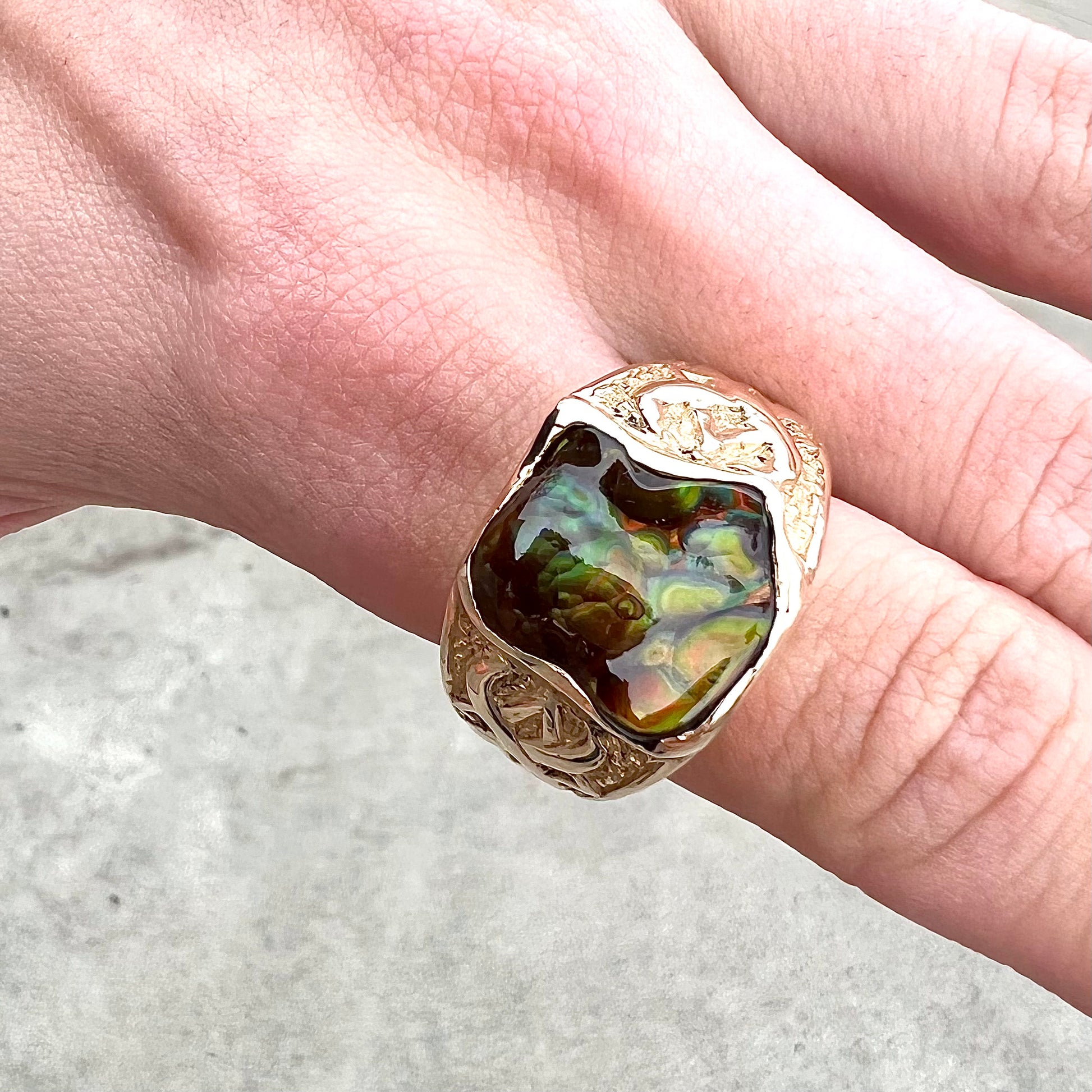 Custom, heavy yellow gold men's ring set with fire agate from Deer Creek, Arizona.