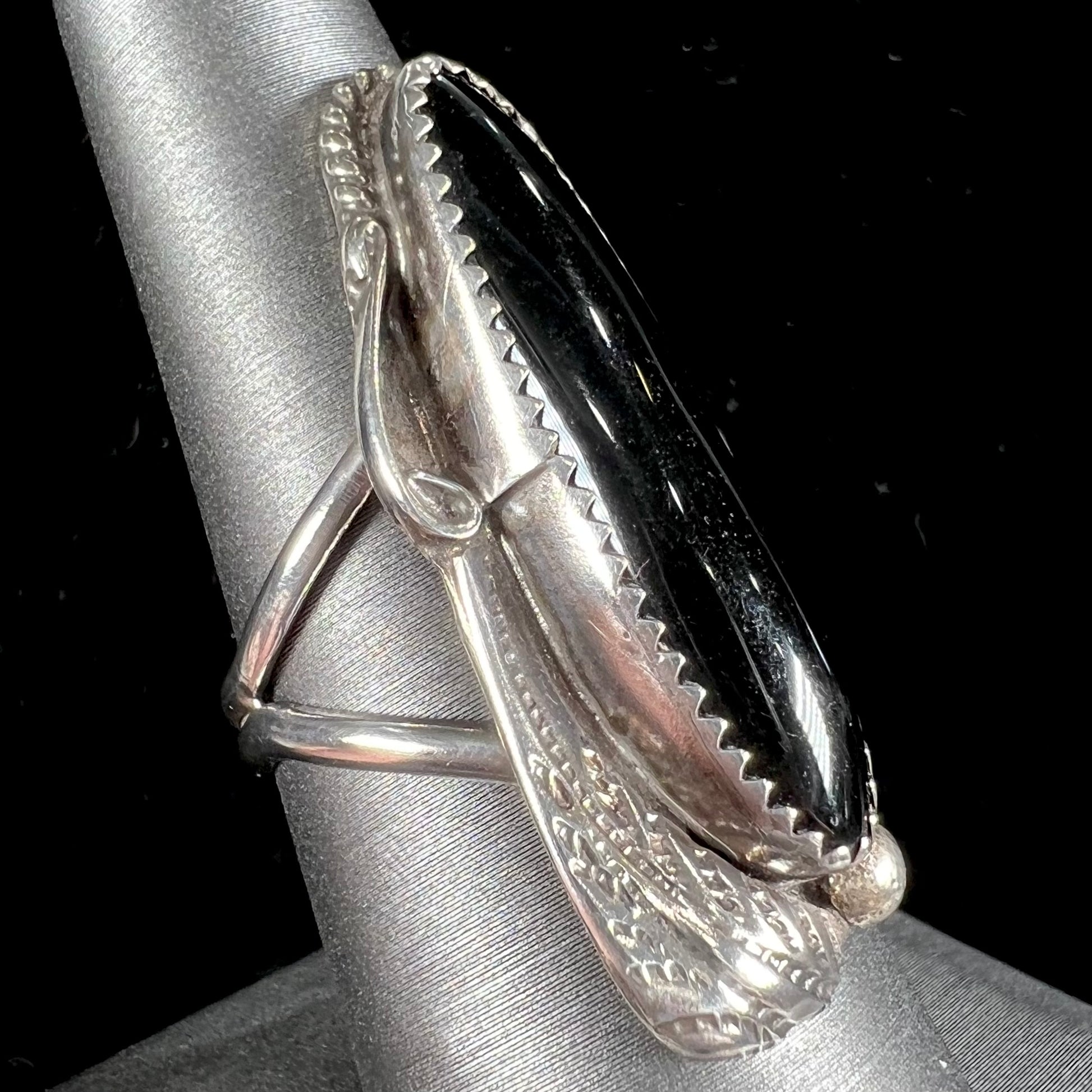 An elongated silver onyx ring handmade by Navajo artist, Tom Taylor.