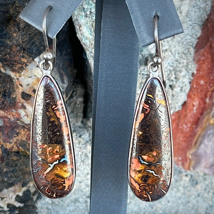 A pair of sterling silver boulder opal drop dangle earrings.