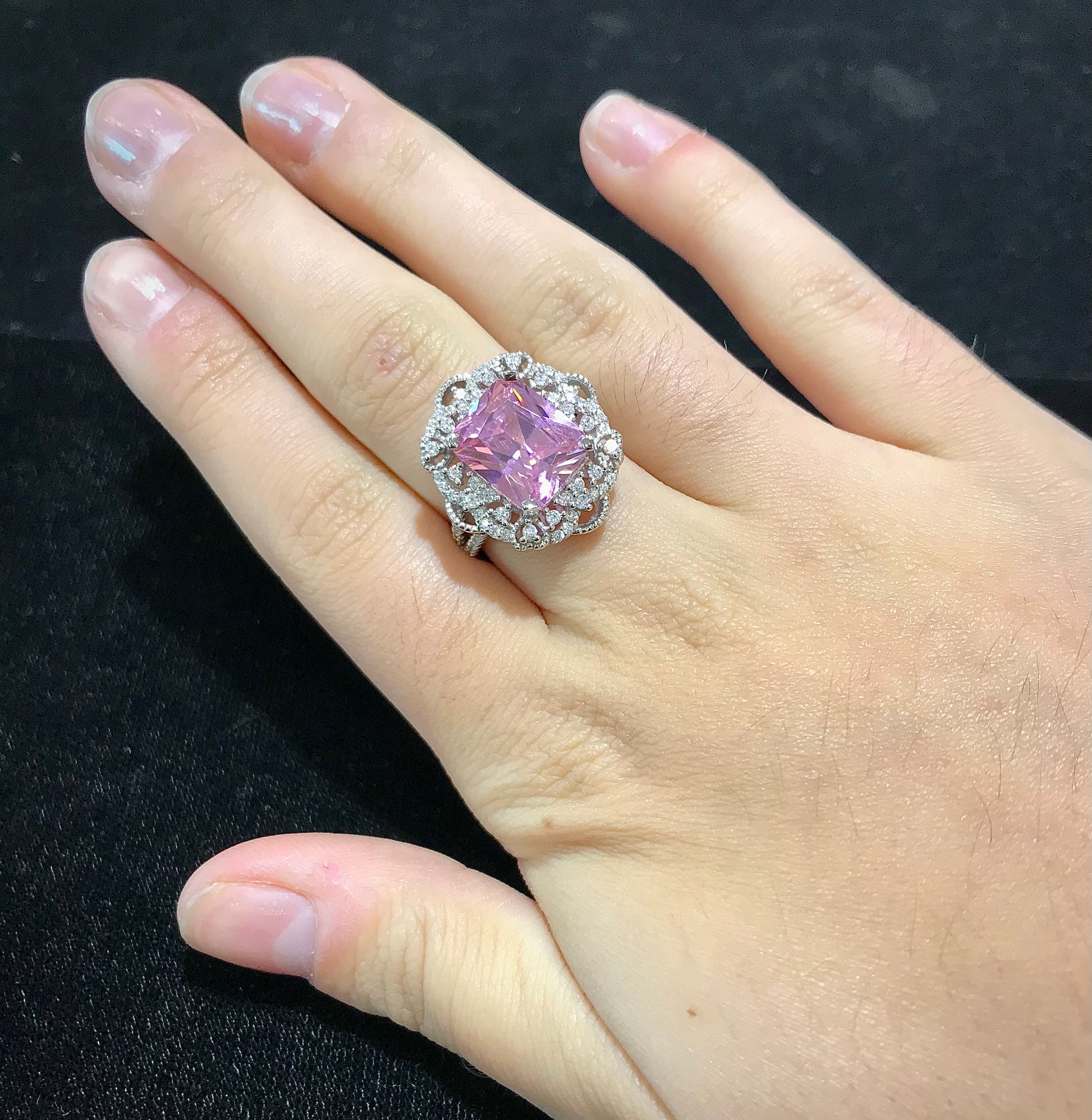 Pink synthetic gemstone ring set in sterling silver.