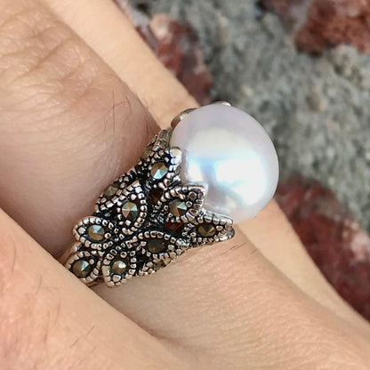 Fresh water pearl ring set in a unique sterling silver cast setting with marcasite.
