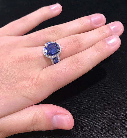 Synthetic blue and white gemstone ring prong set in sterling silver.