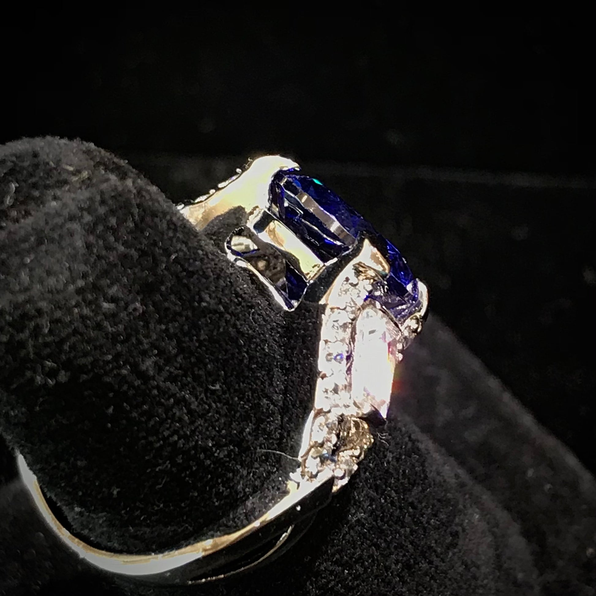 Dark blue synthetic gemstone and cubic zirconia set in sterling silver.