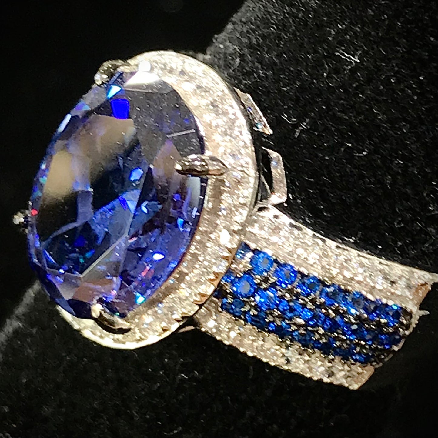Synthetic blue and white gemstone ring prong set in sterling silver.