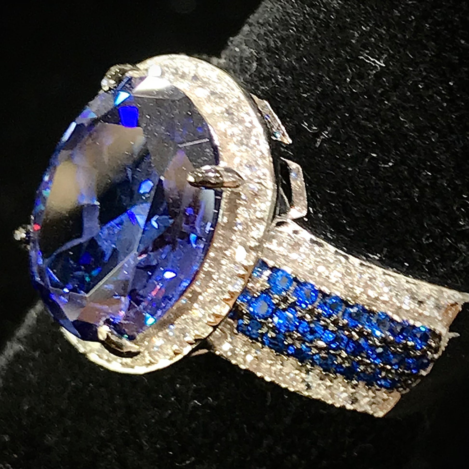 Synthetic blue and white gemstone ring prong set in sterling silver.