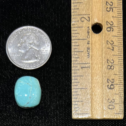 Loose cabochon cut Sleeping Beauty turquoise stone.