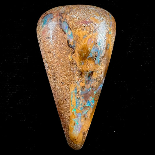 A polished, drilled pipe boulder opal bead.