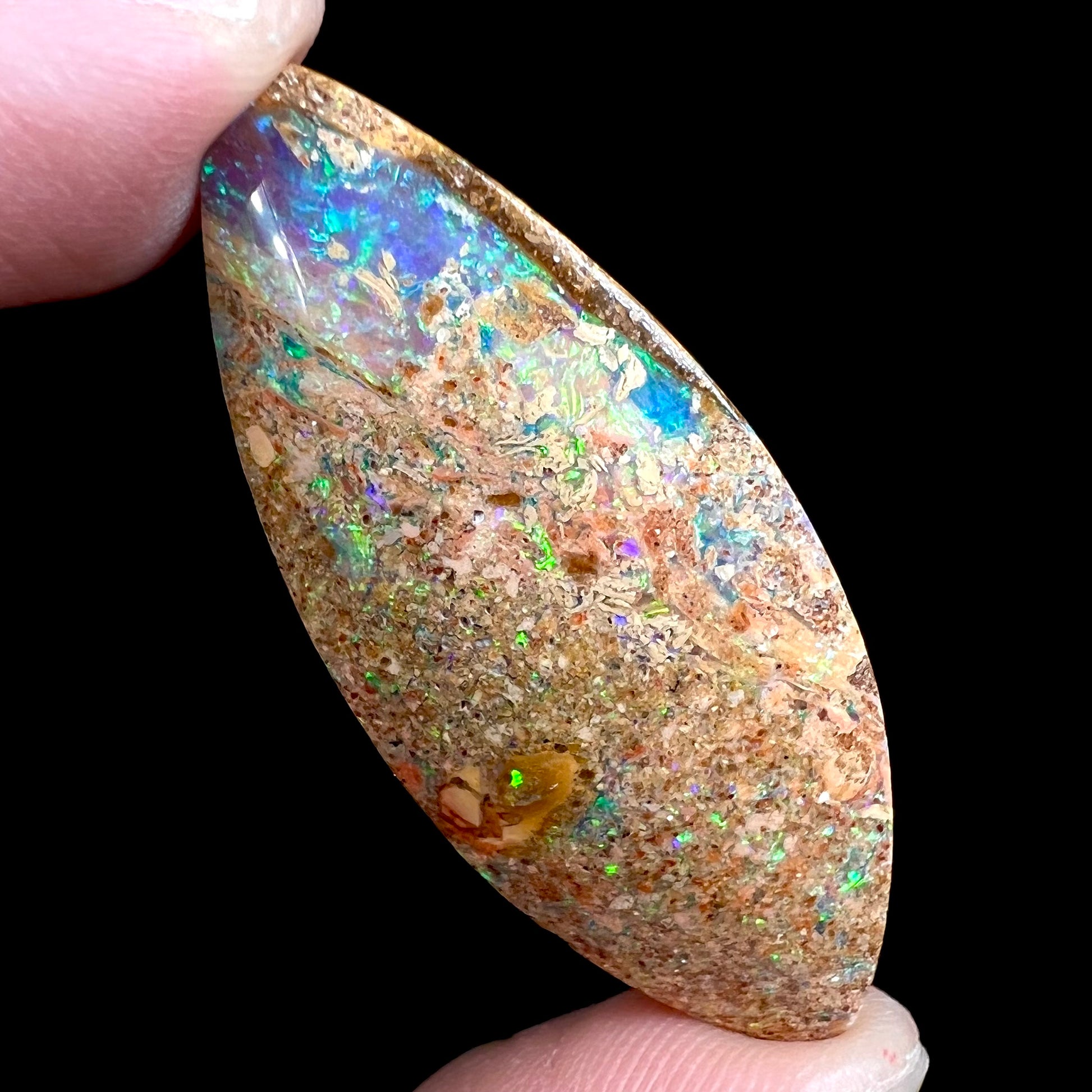 A polished, drilled pipe boulder opal bead.
