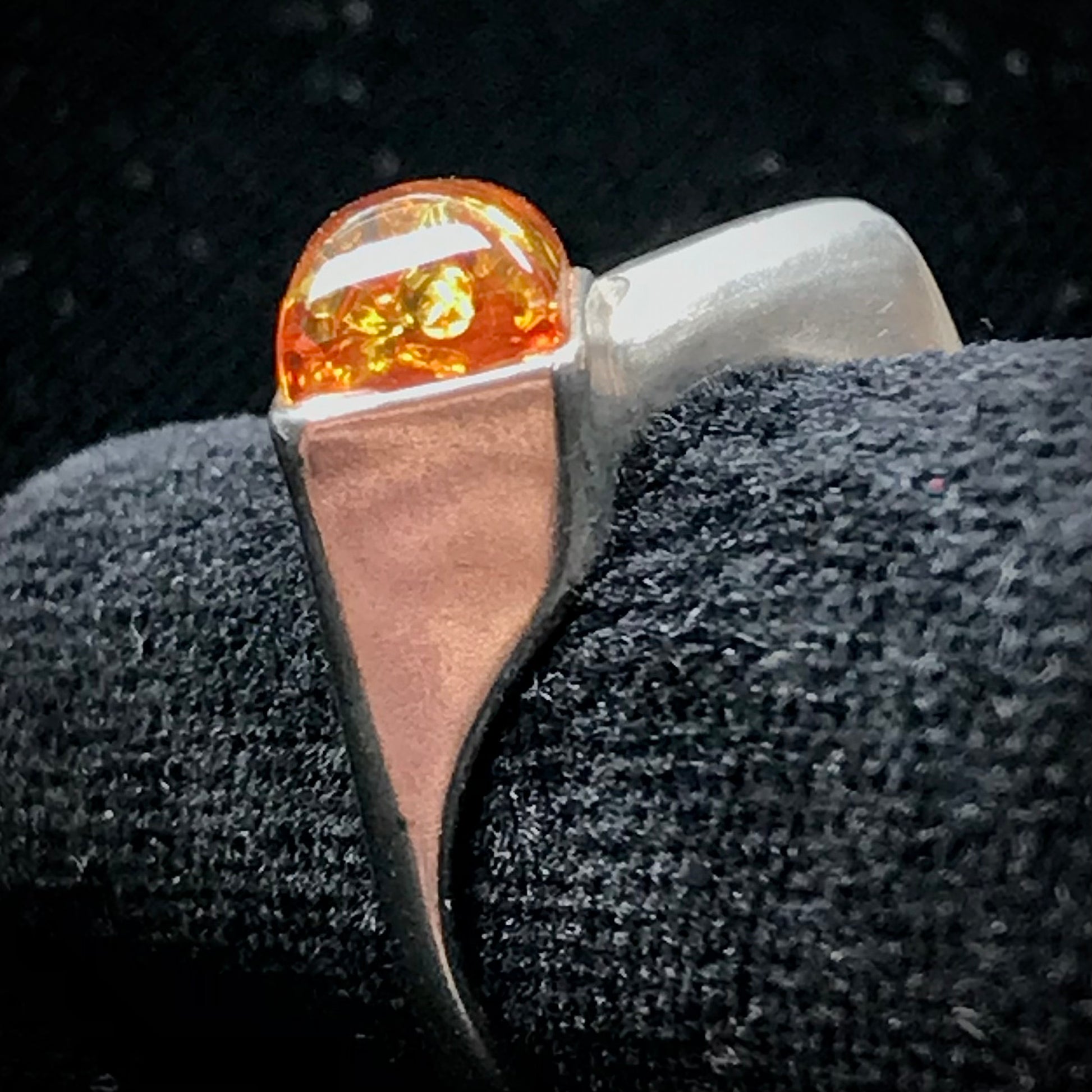Square shaped Baltic Amber cabochon set in a unique sterling silver ring.