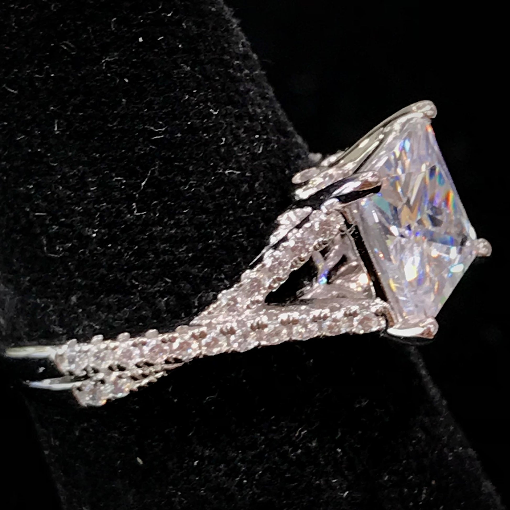 Women's cubic zirconia princess cut ring set in sterling silver with a twisted shank.