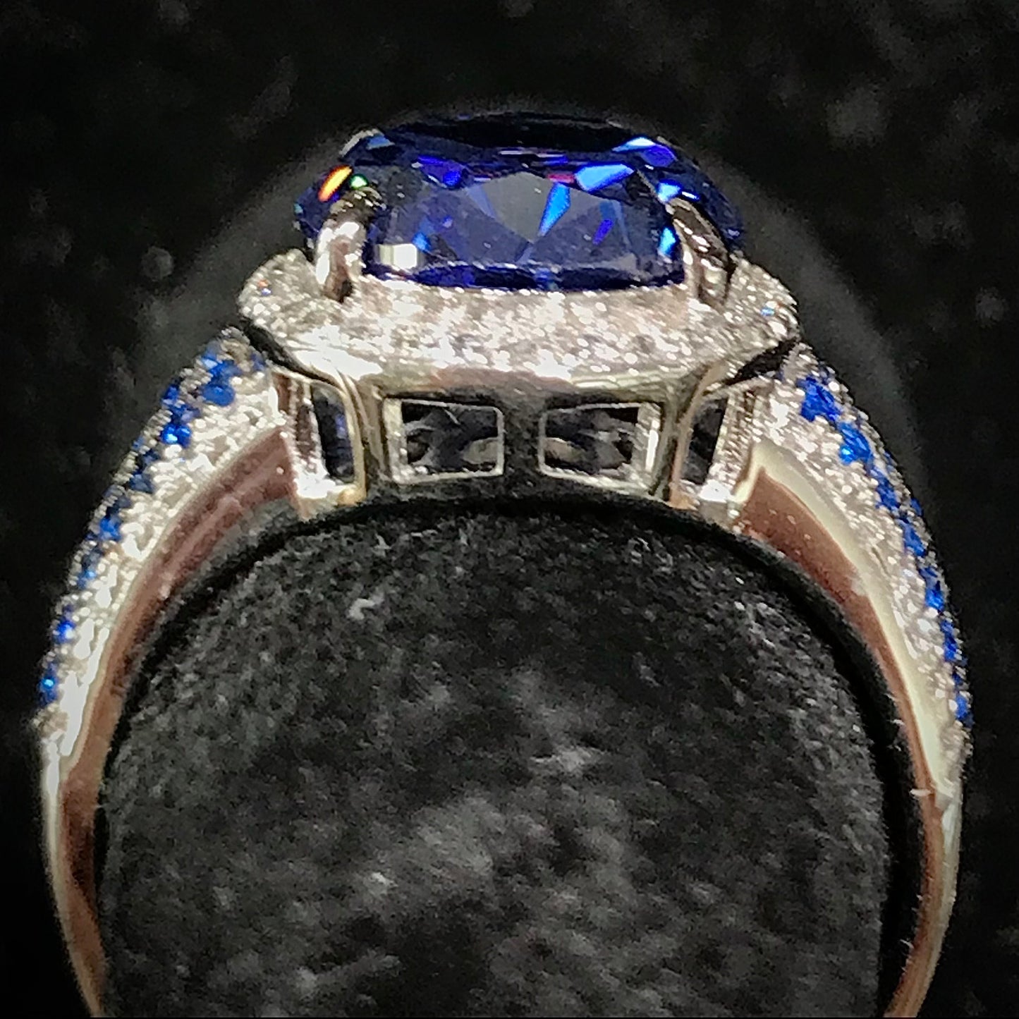 Synthetic blue and white gemstone ring prong set in sterling silver.