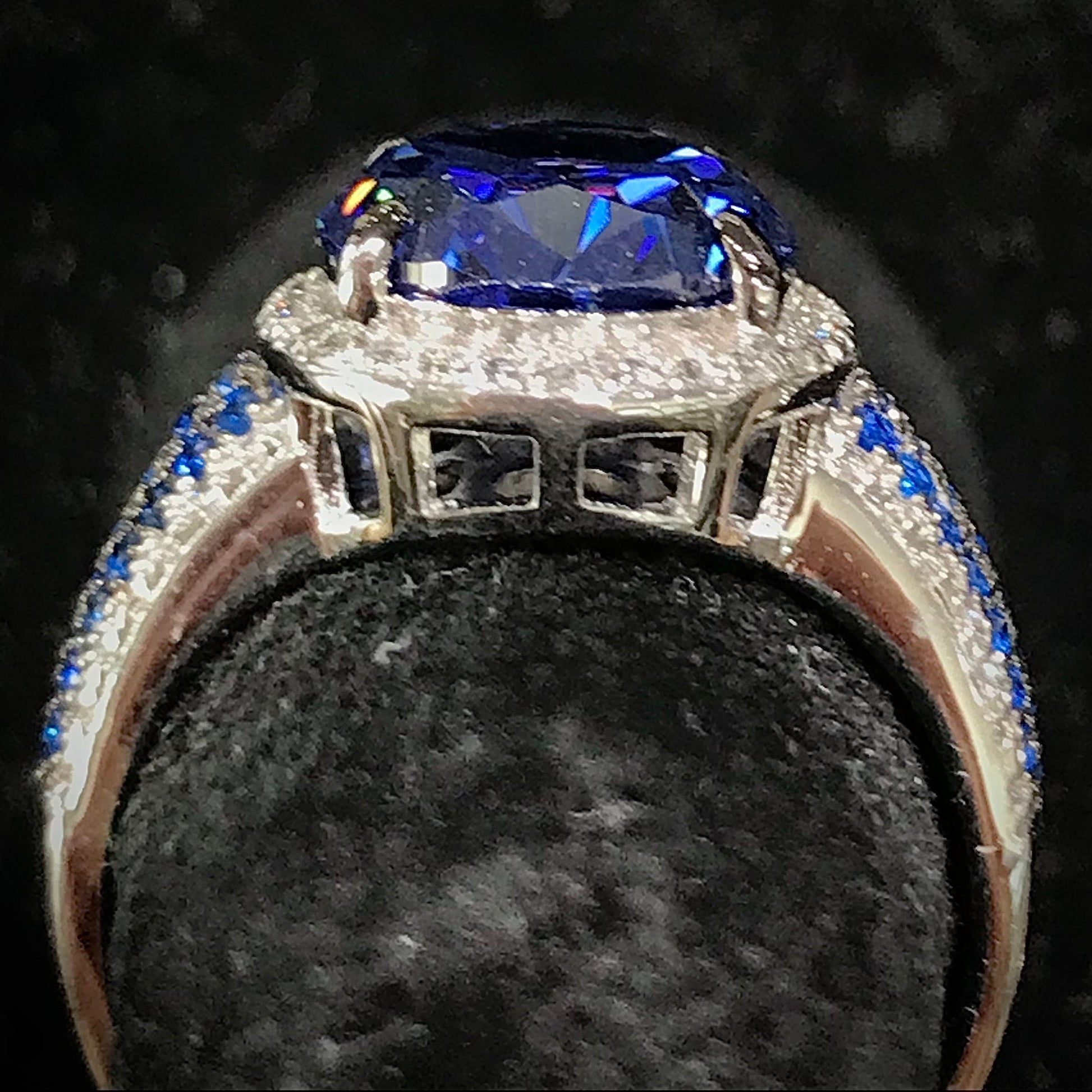Synthetic blue and white gemstone ring prong set in sterling silver.