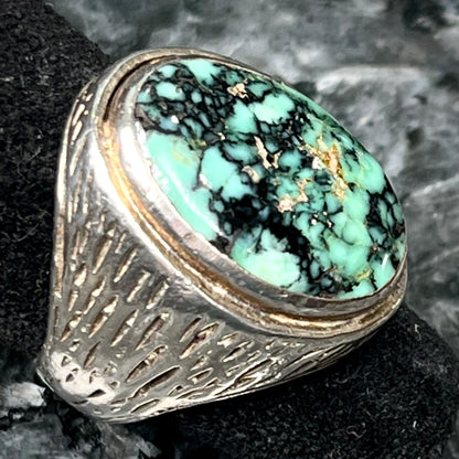 A sterling silver solitaire ring set with a black spiderweb turquoise stone from Kingman, Arizona.