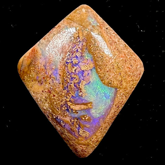 A polished, drilled pipe boulder opal bead.