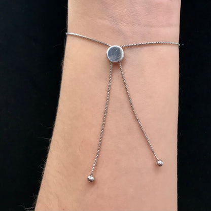 Pink dyed opal adjustable bracelet prong set in sterling silver.