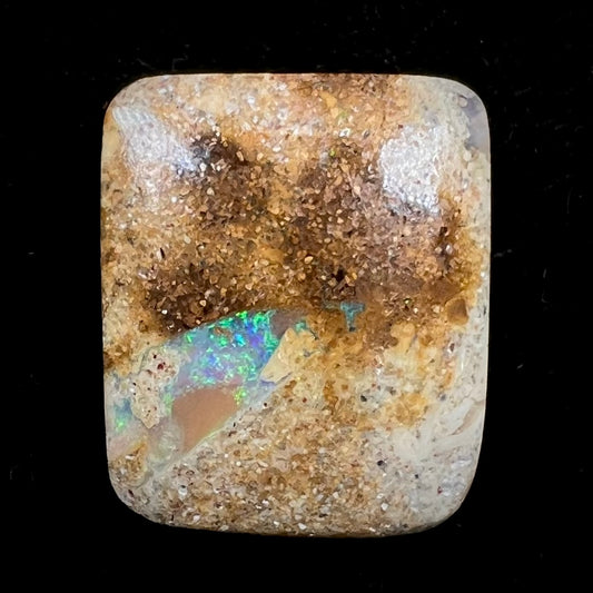 A polished, drilled pipe boulder opal bead.