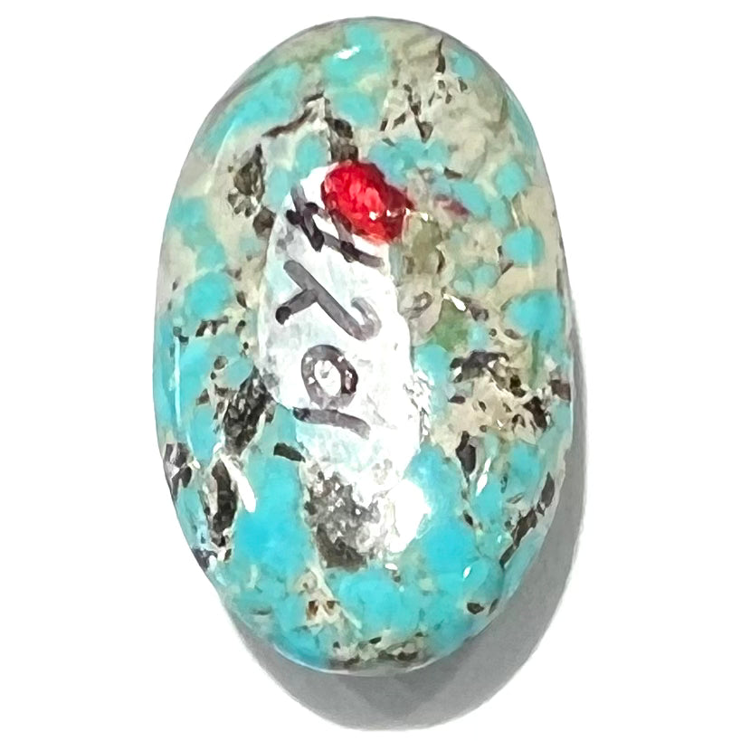 A loose, oval cabochon cut turquoise stone from Valley Blue Mine in Lander County, Nevada.