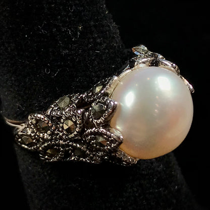 Fresh water pearl ring set in a unique sterling silver cast setting with marcasite.