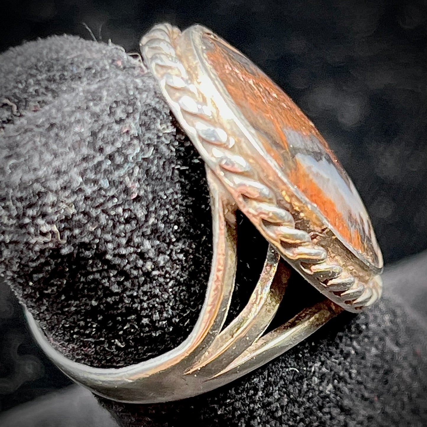 Plume Agate ring set in sterling silver with a twisted rope bezel design.