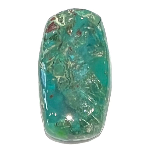 A loose, green, barrel cabochon shaped chrysocolla stone from Morenci, Arizona.