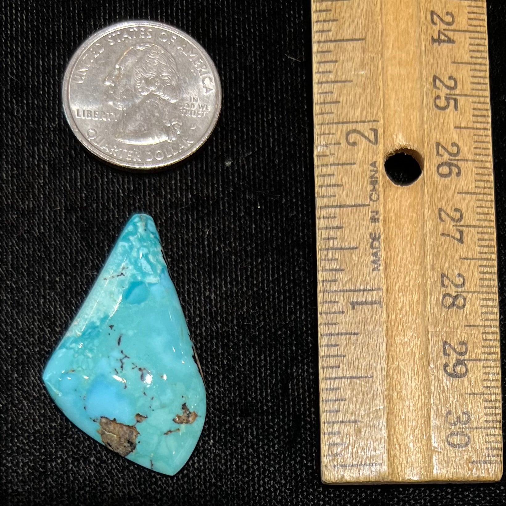 A loose, drop shape turquoise stone from the Sleeping Beauty Mine.