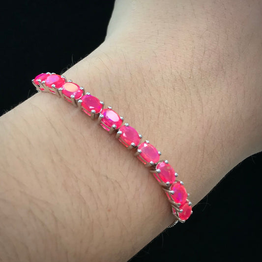 Pink dyed opal adjustable bracelet prong set in sterling silver.