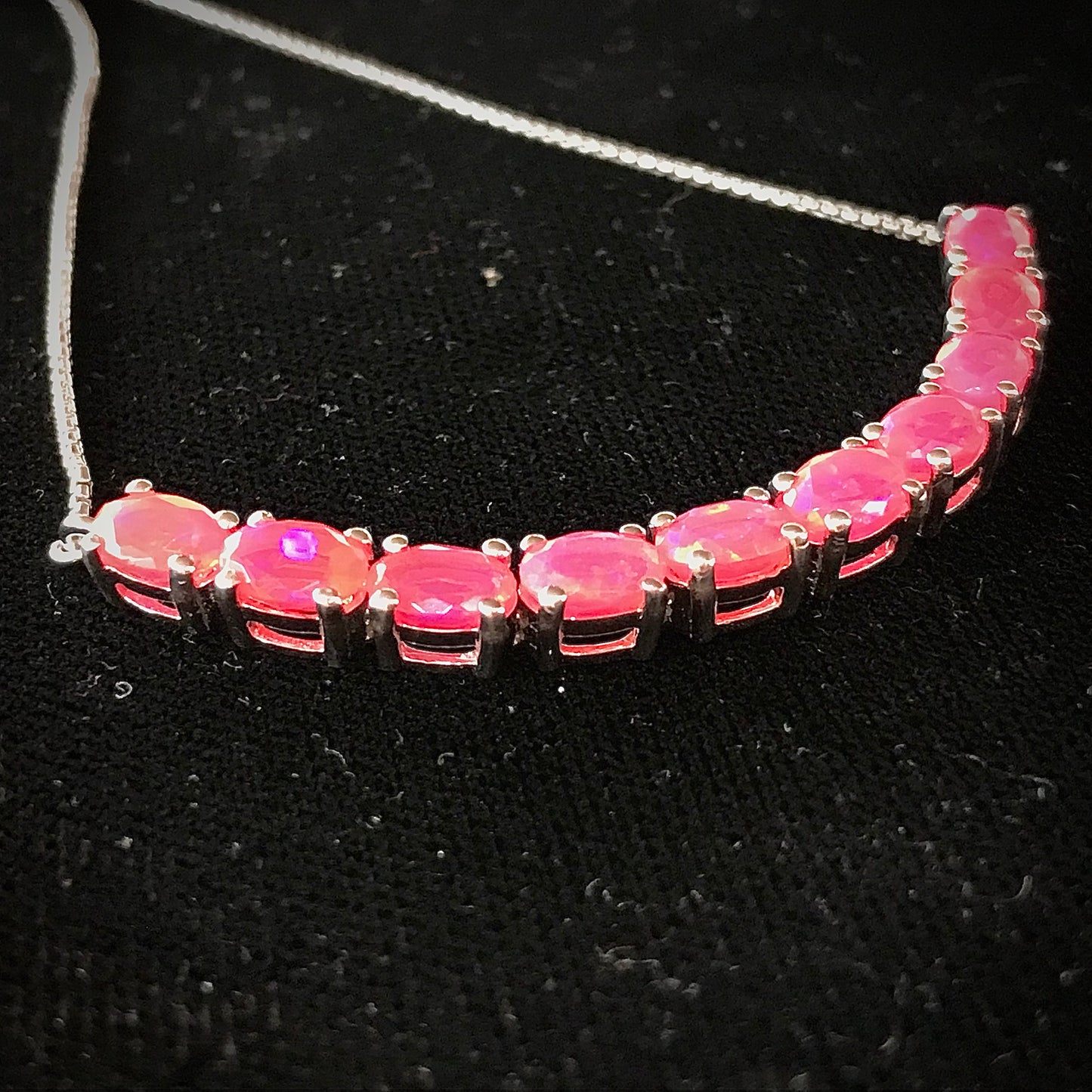 Pink dyed opal adjustable bracelet prong set in sterling silver.