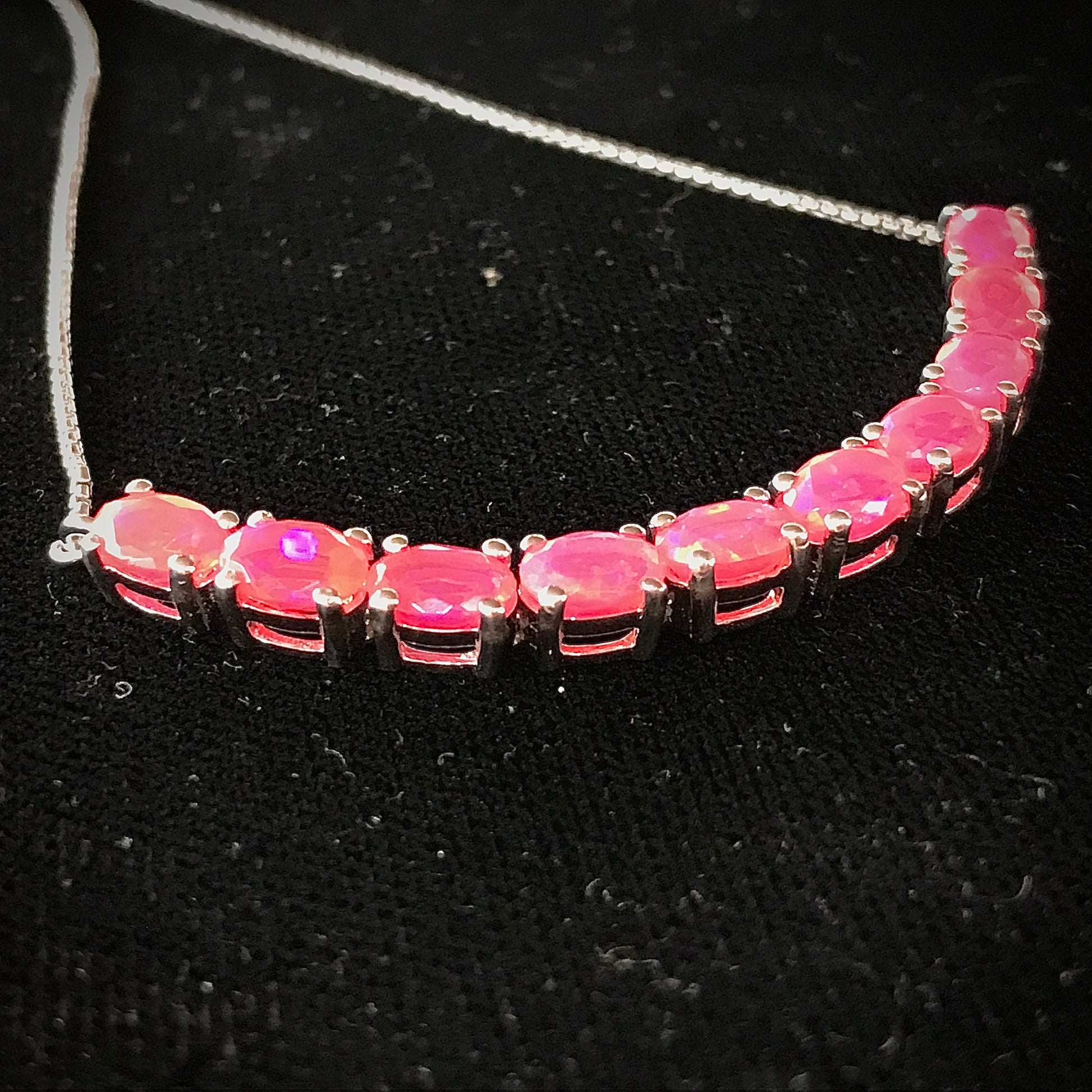 Pink dyed opal adjustable bracelet prong set in sterling silver.