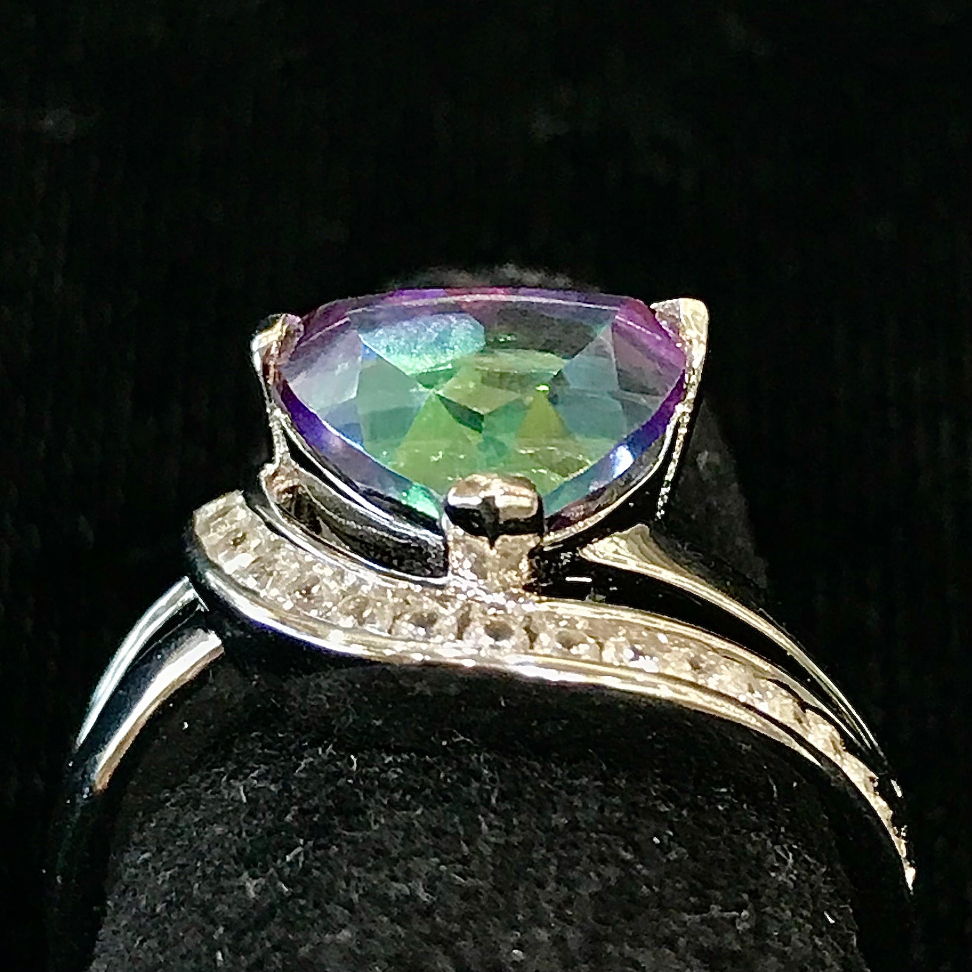 Mystic topaz ring with cubic zirconia side stones set in sterling silver with a double band design.