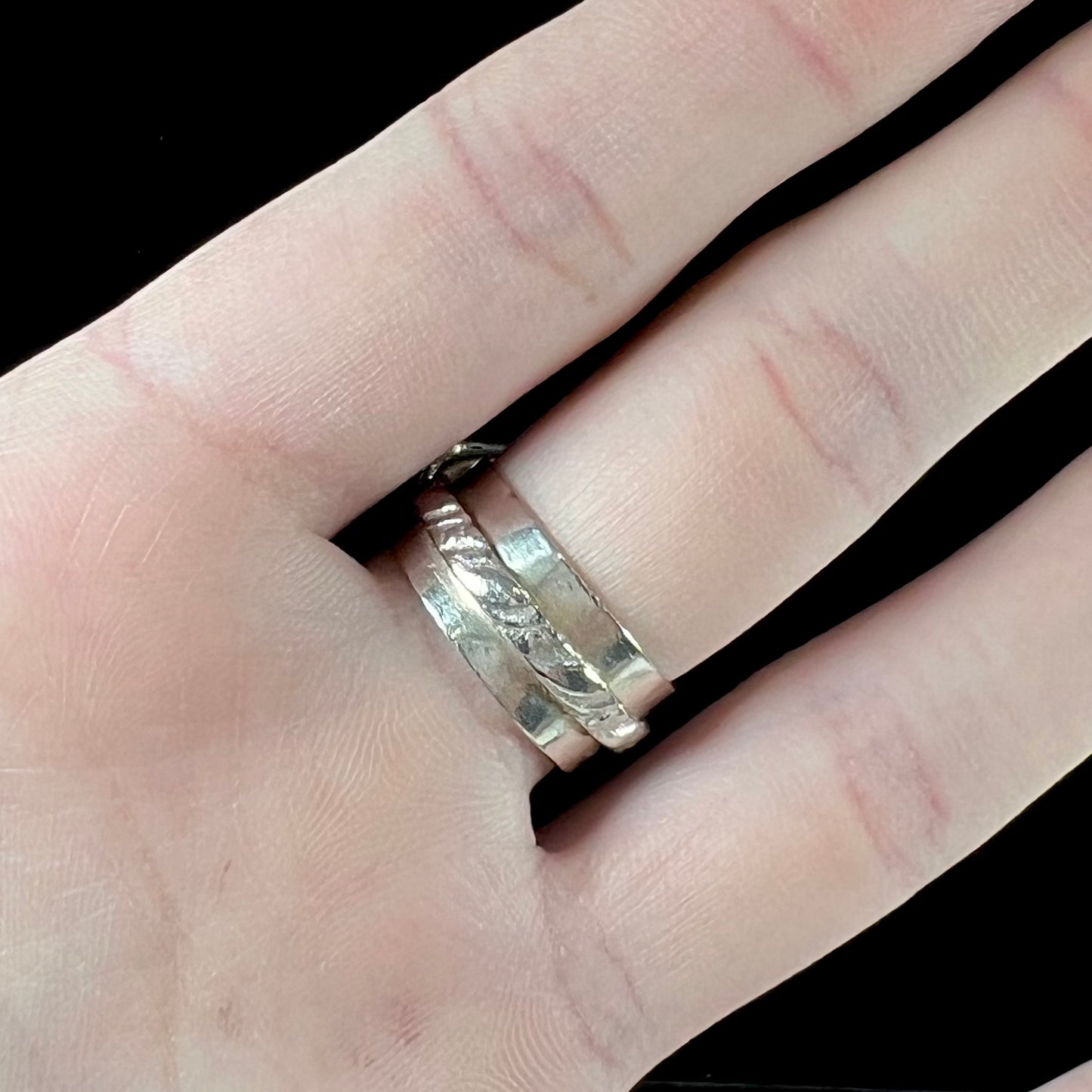 A handmade sterling silver, unisex, likely Navajo ring set with Tibetan turquoise.