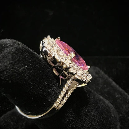 Pink synthetic gemstone ring set in sterling silver.