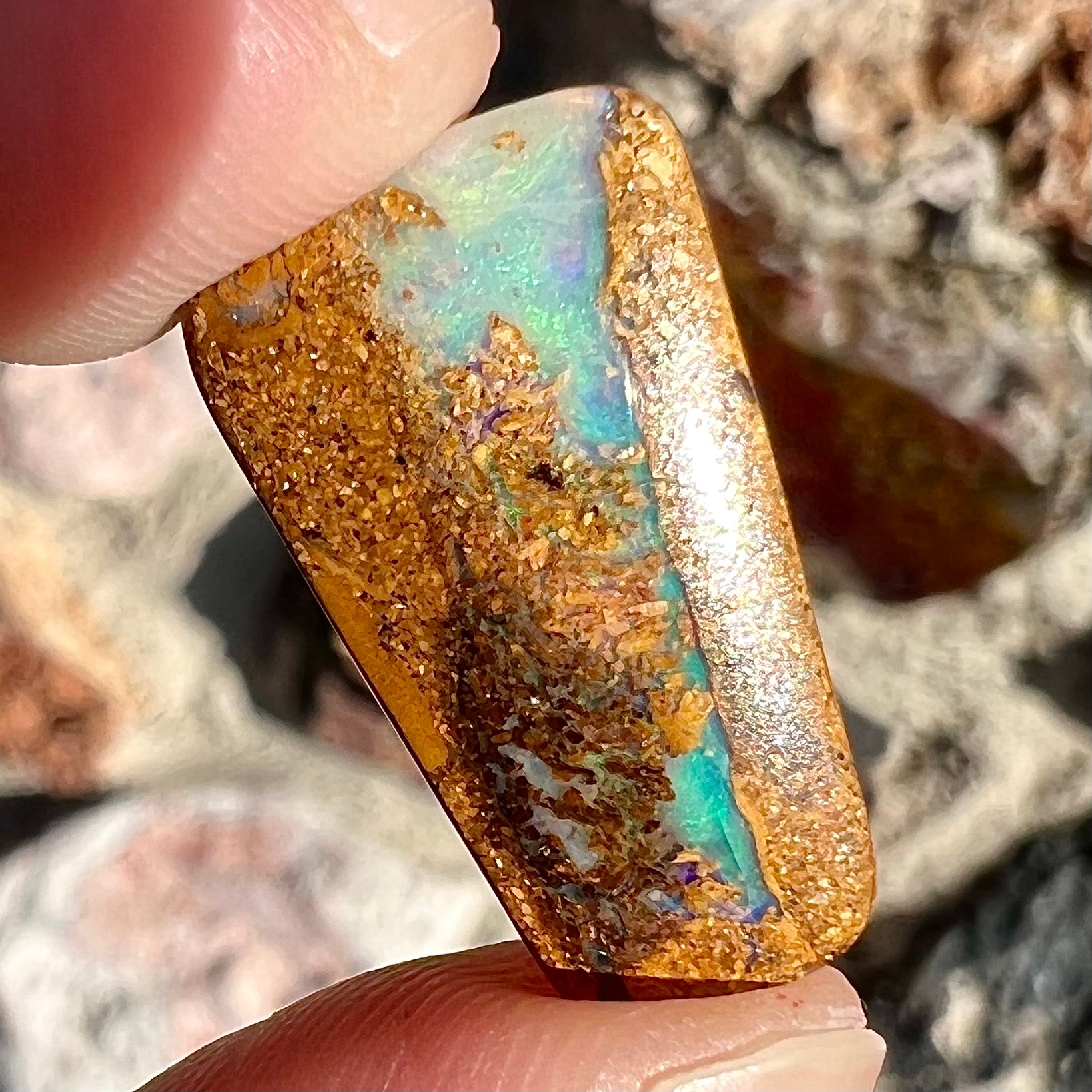 A polished, drilled pipe boulder opal bead.