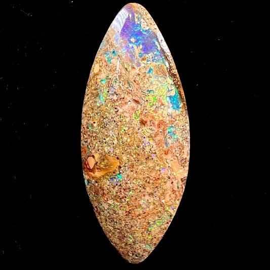 A polished, drilled pipe boulder opal bead.