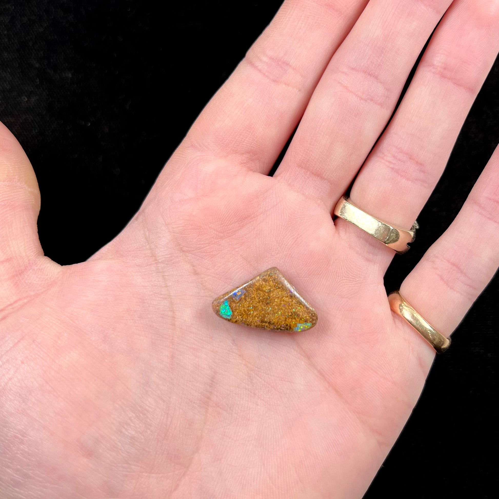 A polished, drilled pipe boulder opal bead.