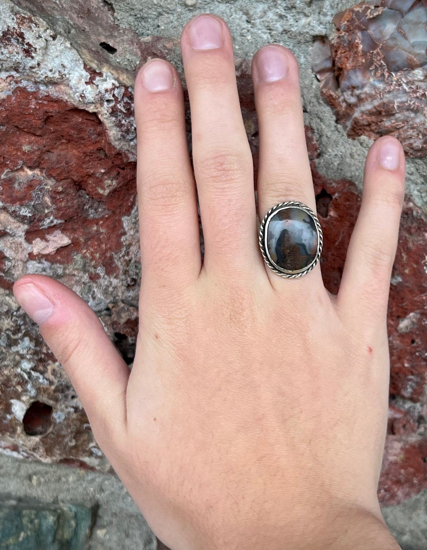 Plume Agate ring set in sterling silver with a twisted rope bezel design.
