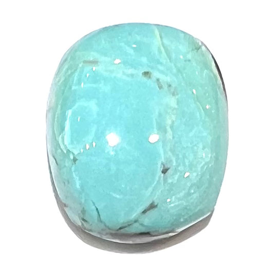 Loose cabochon cut Sleeping Beauty turquoise stone.